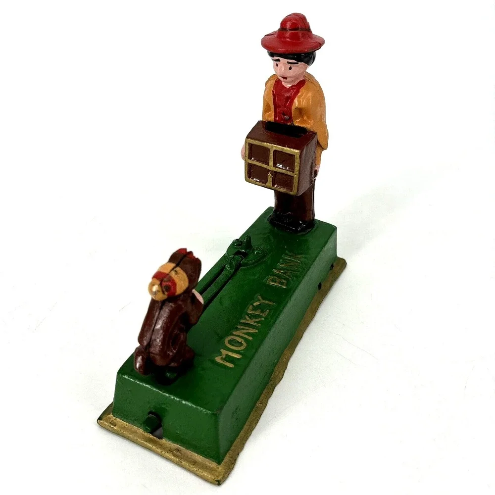 ORGAN GRINDER MONKEY BANK Cast Iron Works Great‎